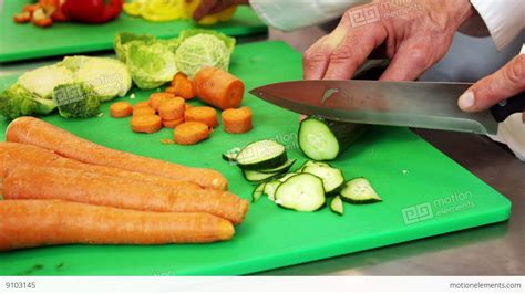 Chef Chopping Vegetables On Green Board Stock Video Footage 9103145