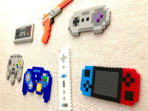 These Pieces Feature The Iconic Controllers Of Nintendo Hundreds Of
