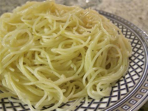 Angel hair pasta with olive oil, garlic and parmesan cheese. Angel Hair Pasta with Olive Oil and Garlic | Vegan Chronicle