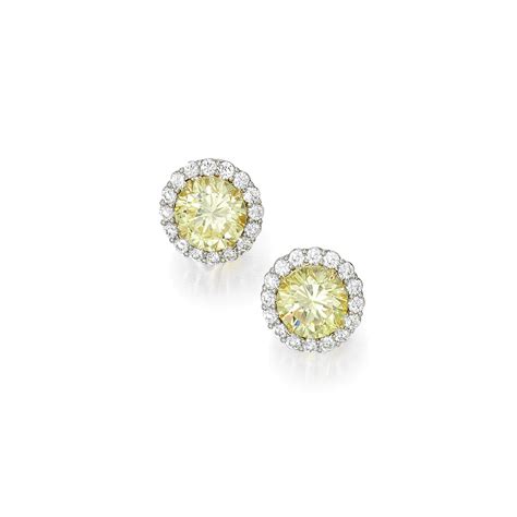 Pair Of Fancy Intense Yellow Diamond Earrings Centering Two Round Fancy Intense Yellow Diamonds
