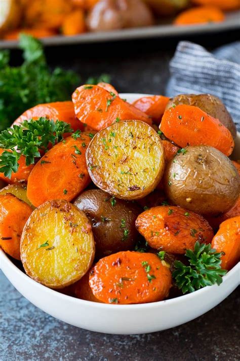 Beef goulash with carrots and roasted potatoes in a white bowl. These roasted potatoes and carrots are coated in butter, garlic and herbs, then cooked un… in ...