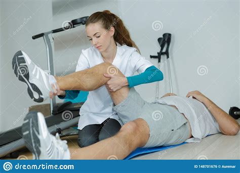 Therapist Stretching Patients Leg Stock Photo Image Of Health Doctor