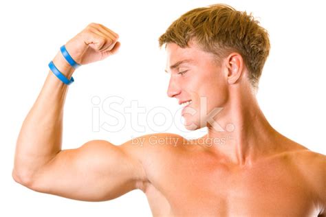 Portrait Of Handsome Muscular Young Man Flexing Biceps Isolated Stock