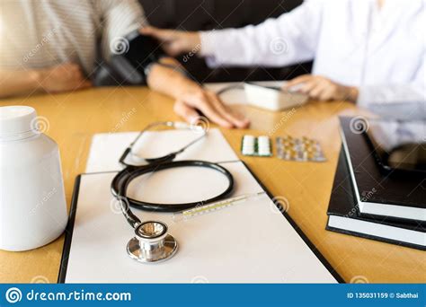 Doctor Explaining Patient Symptoms Or Asking A Question Stock Image