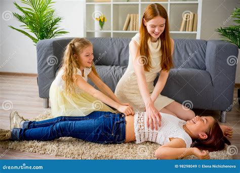 Mother And Two Daughters Playing And Tickling Stock Image Image Of Adult Home 98298049