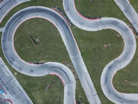 Curvy Race Track On Green Field By Stocksy Contributor Guille