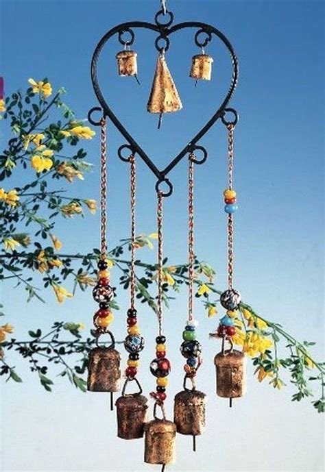 A Heart Shaped Wind Chime With Bells Hanging From Its Sides And