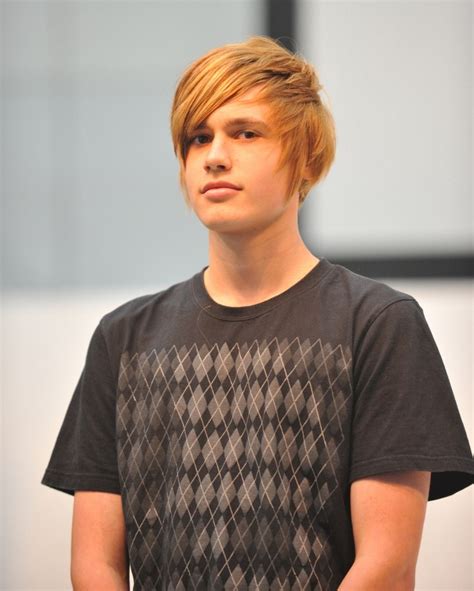 Young Man With Short Blonde Hair And Forward Swept Strands