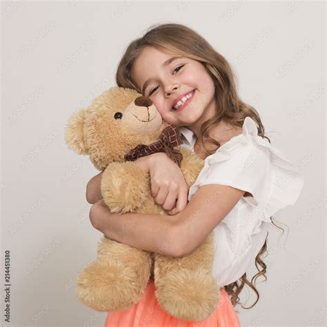 Cartoon Little Girl With Teddy Bear Holding Hand Vect