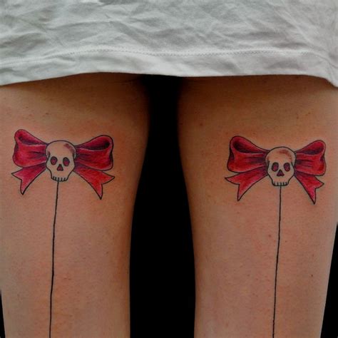 Skull Bow Tattoos On Legs