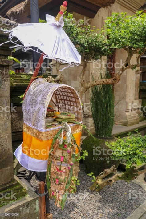 Altar Woven From Bamboo Wicker Covered With White Cloth With Gold