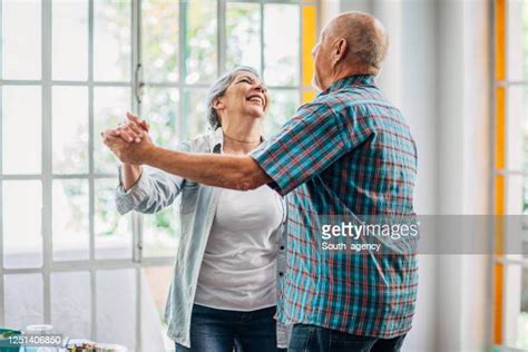 Old Couple Dance Living Room Photos And Premium High Res Pictures