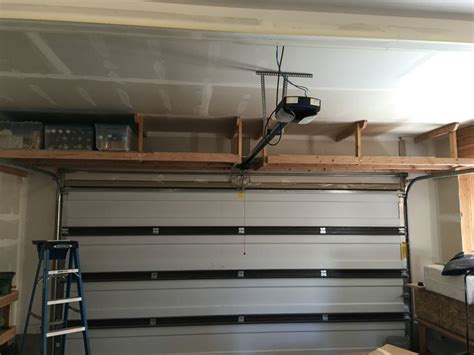 A hoist is a great way to create garage storage overhead or for garage bike storage. 2 x 4 overhead garage storage (#QuickCrafter) | Overhead ...