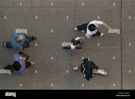 Overhead View From Hotel Room Of People Walking On Sidewalk Midtown