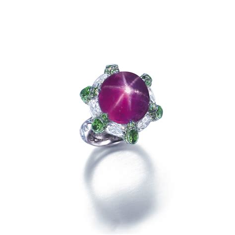 A Rare Purple Star Sapphire Tsavorite Garnet And Diamond Ring By