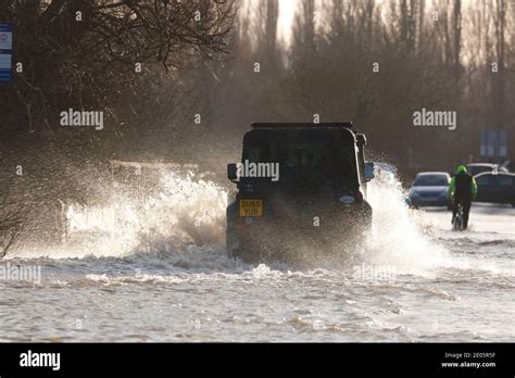 A Landrover Makes A Splash While Driving Though Storm Bella Flooding On