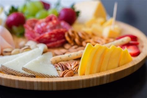 Premium Photo Close Up Of Cheese And Cold Cuts Platter
