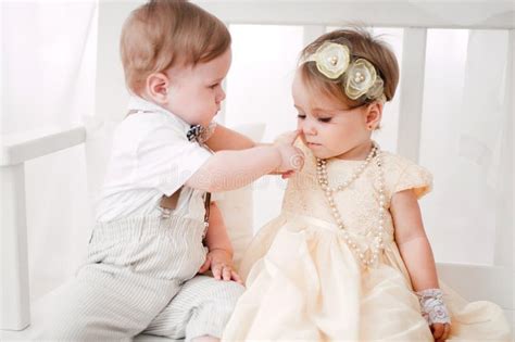 Two Babies Wedding Boy And Girl Dressed As Bride And Groom Stock