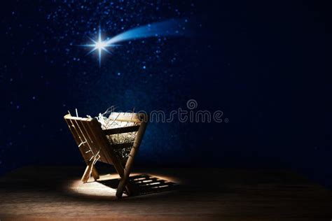 Nativity Of Jesus Empty Manger At Night With Bright Lights Stock