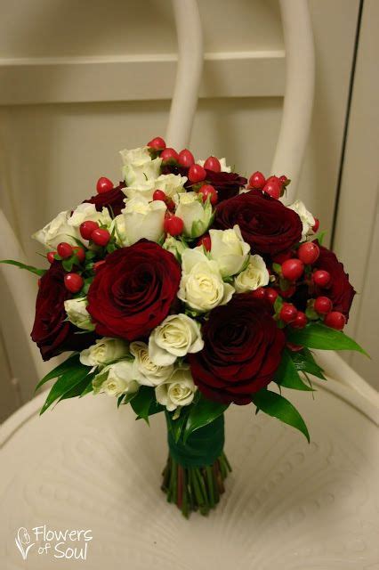 A Bouquet Of Roses And Other Flowers On A Chair