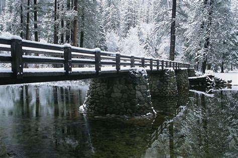 Winter Photography A Snow Covered Footbridge Spanning The Merced Rive