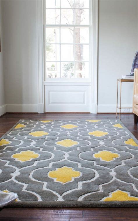 A Gray And Yellow Rug In A Living Room