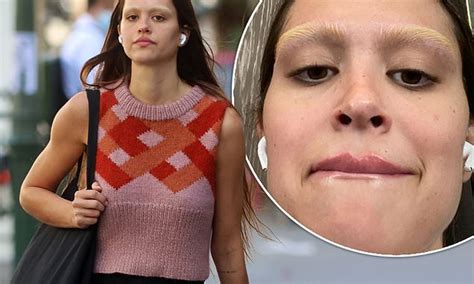 Amelia Hamlin Shows Off Her Bleached Eyebrows As She Wears Cosy Striped Sweater Vest In Paris