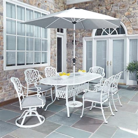 Homestyles Capri White 9 Piece Cast Aluminum Oval Outdoor Dining Set