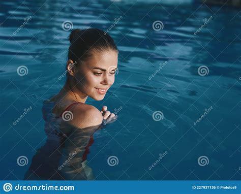 Pretty Woman Swimming In The Pool Nature Relaxation Luxury Tan Stock