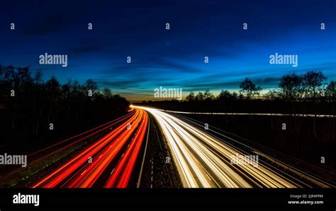 Motorway Fast Traffic Light Trails At Night Stock Photo Alamy