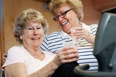 Older Women Laughing Together Stock Photo Dissolve