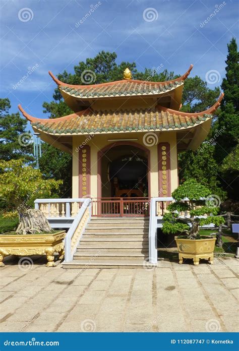 The Vietnamese Pagoda Is Surrounded By Beautiful Trees And Shrub Stock