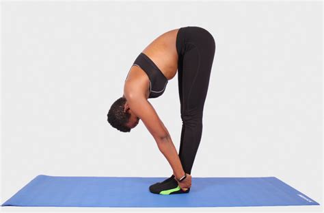 Flexible Woman Doing Forward Bend Yoga Pose
