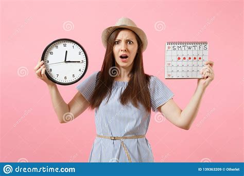 Shocked Confused Sad Woman In Blue Dress Holding Round Clock Periods