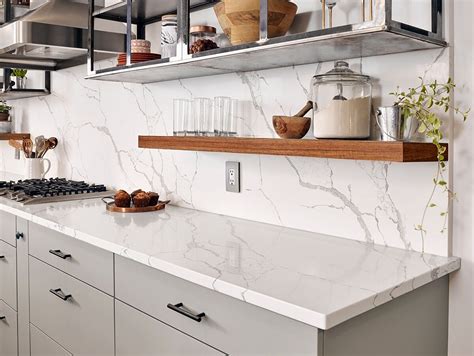 Calacatta Laza Quartz Features A Soft White Background And Soft Brown