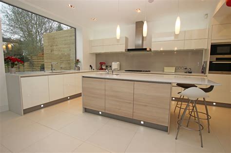 White island with aqua toned seats. Two tone kitchen with light wood island - Modern - Kitchen ...
