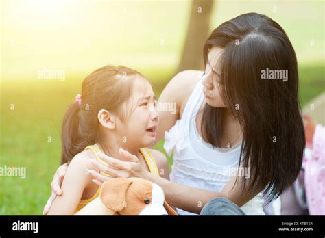 Mother Comforting Crying Child Stock Photo Alamy