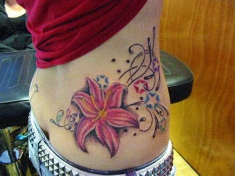Lotus Flowers And Swirl Tattoo Lower Back Tattoomagz › Tattoo