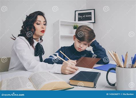 Young Teacher Trying To Explain Information To The Boy Educating