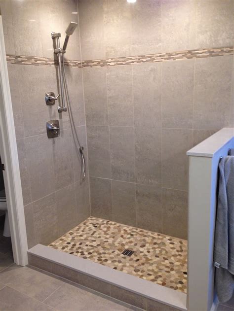 Professional tile setters may have a helper feeding them cut pebbles so the pieces are set in wet thinset that has not skinned over. Create your own pebble shower floor! - Your Projects@OBN