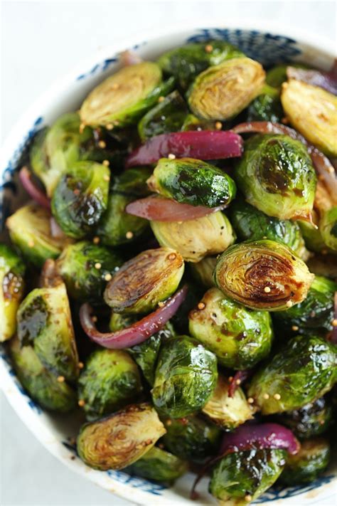 Put in garlic, and sprinkle with salt and pepper. Balsamic Roasted Brussels Sprouts - Eat Yourself Skinny