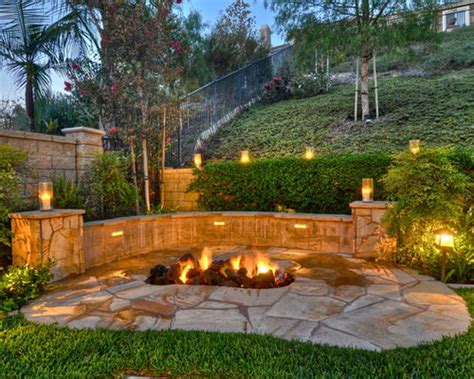 In fact, i deliberately kept a small slope to the yard, so rainwater would continue to flow back and out of the yard as before—no puddles! Fire Pit On A Slope Home Design Ideas, Pictures, Remodel ...
