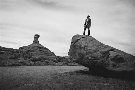 Man Standing On Rock Pictures Download Free Images On Unsplash