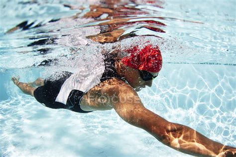 Male Swimmer Athlete Swimming Underwater In Swimming Pool — Reflection