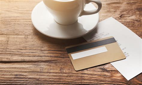 Yes, you may use credit card even just fir s drink. Restaurant Bill And Credit Card On Wooden Table Stock Photo - Download Image Now - iStock