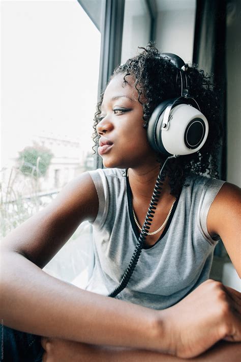 Black Woman With Headphones By Stocksy Contributor Visualspectrum
