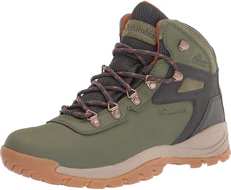 A Pair Of Green Hiking Boots With Orange Laces