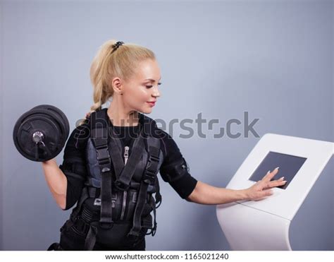Fairhaired Woman Electrical Muscular Stimulation Suit Stock Photo