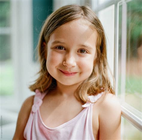 Close Up Of A Cute Young Girl Smiling By Stocksy Contributor Jakob