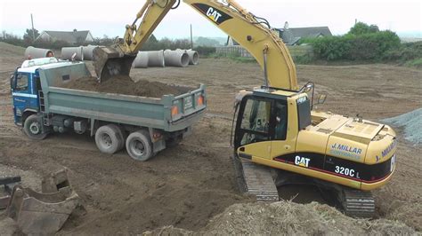 CAT C Excavator Loading Trucks YouTube